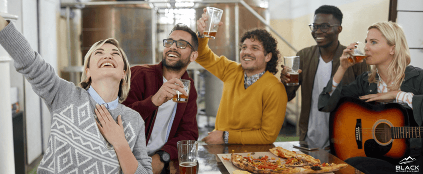People drinking at a brewery.