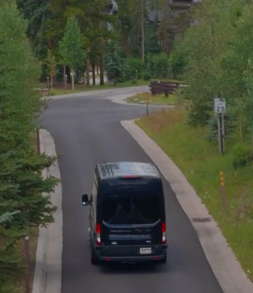 Black van on a road.